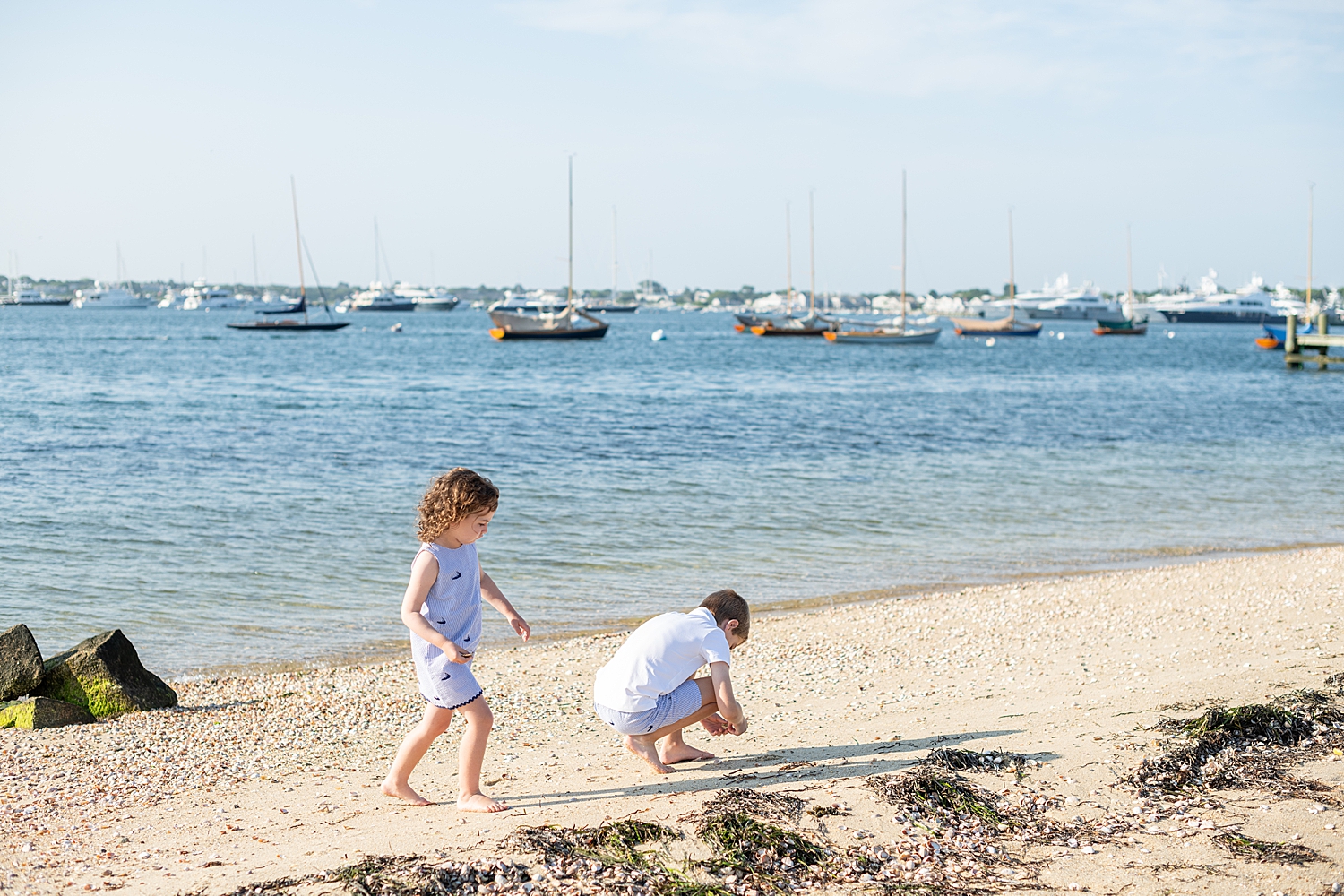children play on sand after learning top locations in Nantucket for your family photo session