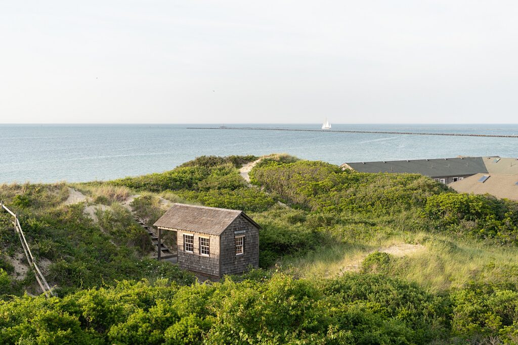 old house overlooks water by Massachusetts family photographer