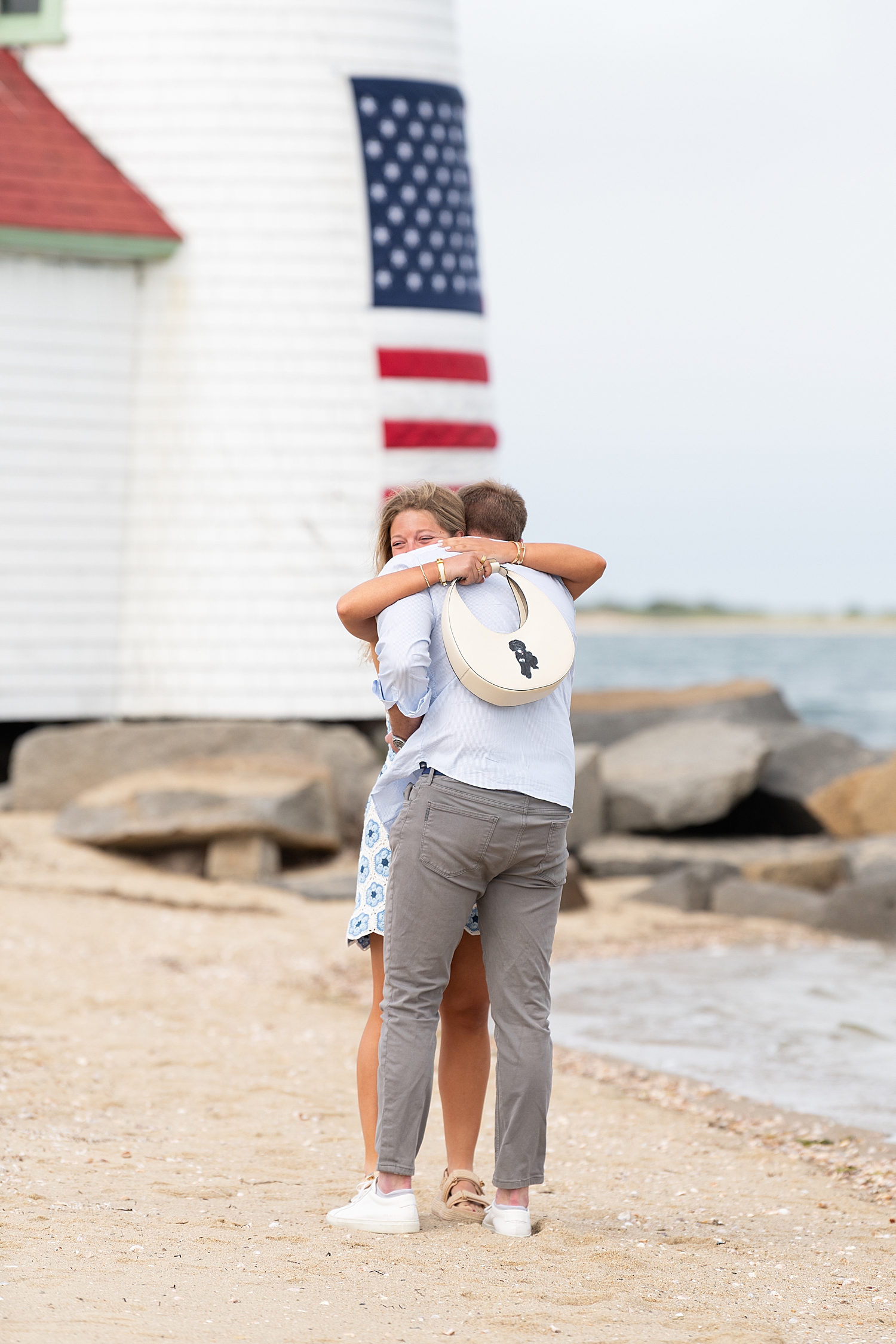 woman wraps up her man in tight embrace after saying YES! by Rachel Elizabeth Photography