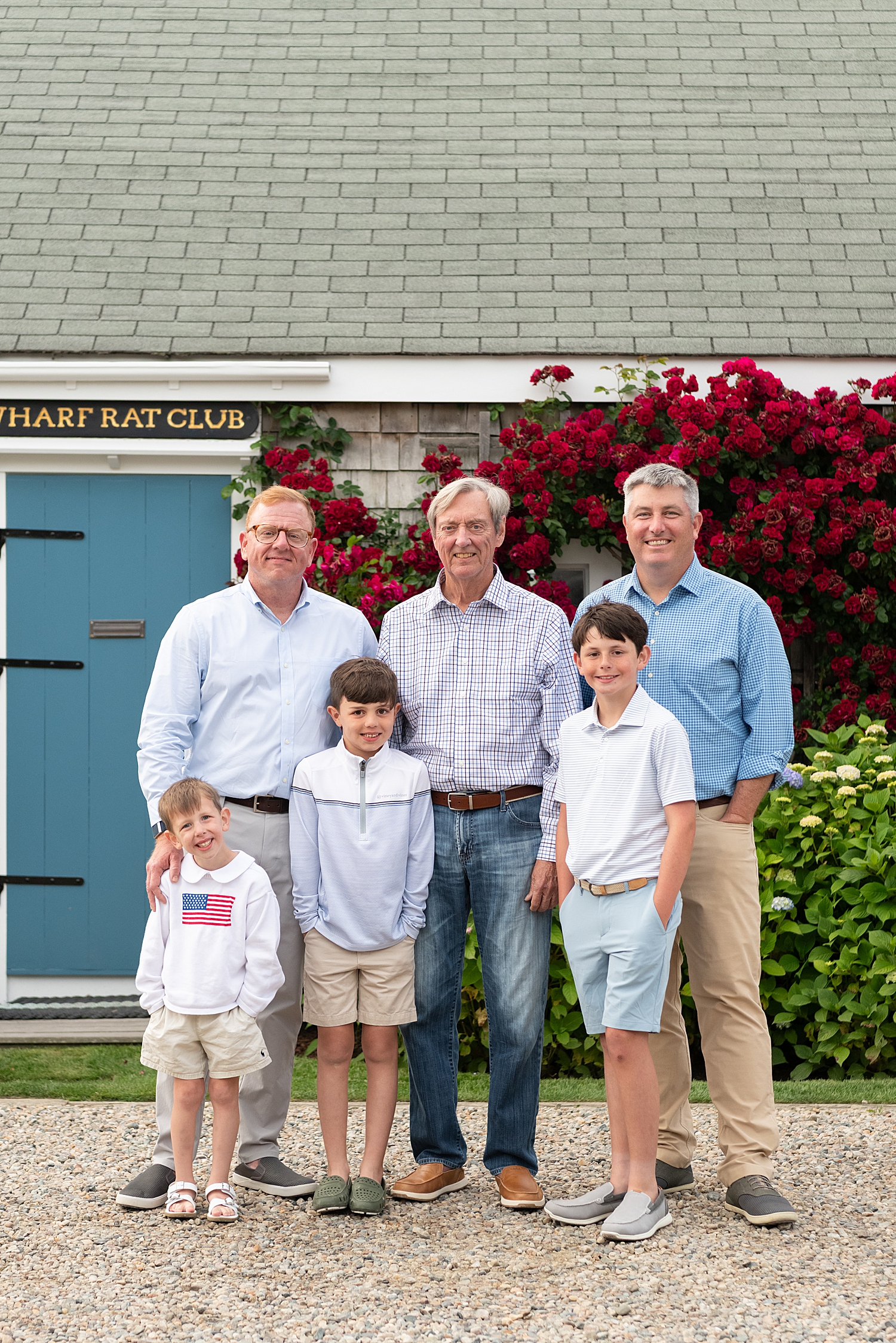 three men and three boys in front of florals at Old North Wharf