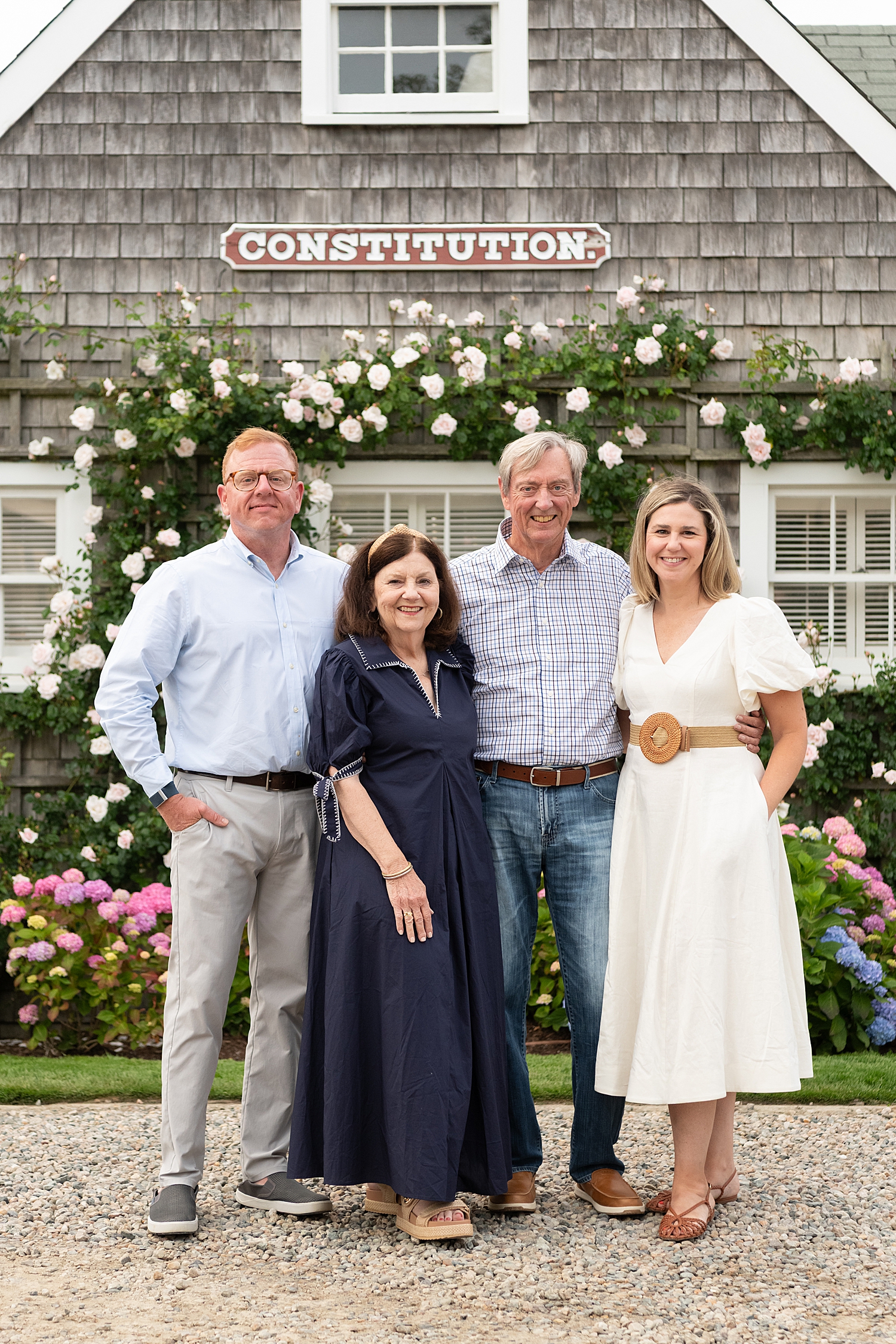 Two couples stand in front of old building at Old North Wharf