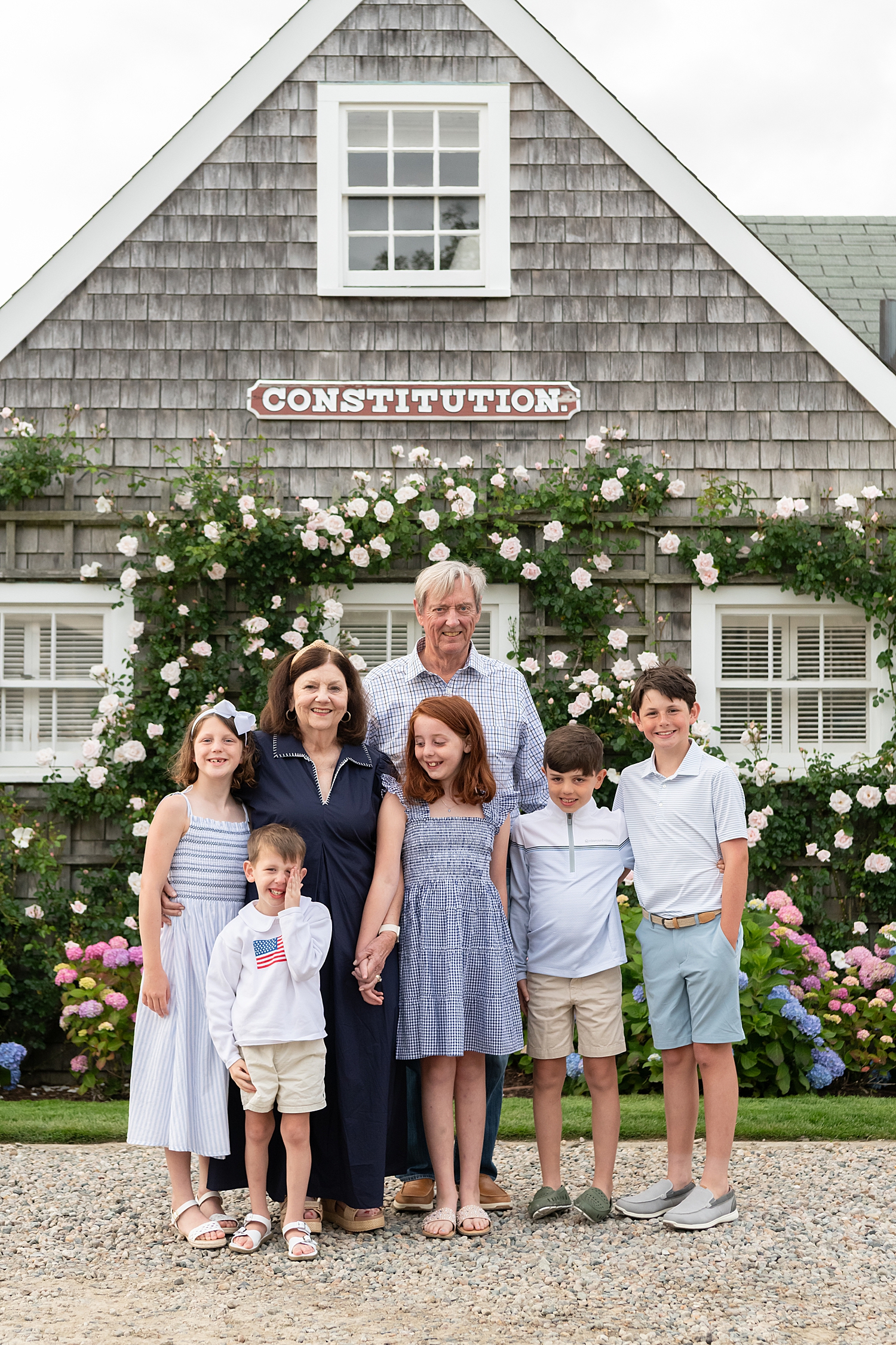 grandparents stand with their grandkids by Nantucket Family Photographer