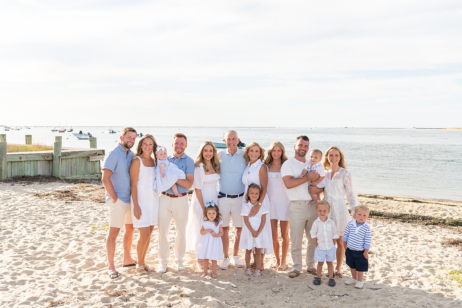 large group gathers on the beach after learning what to wear