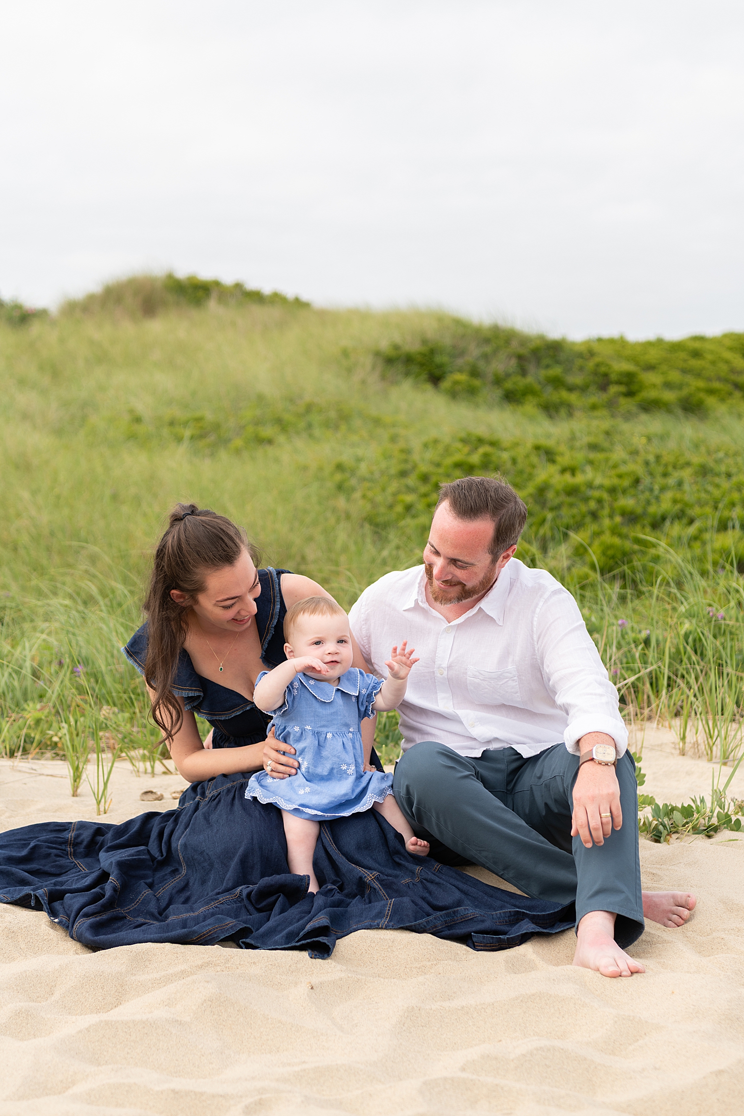 family of three sits in sand for Summer session at Washing Pond Beach
